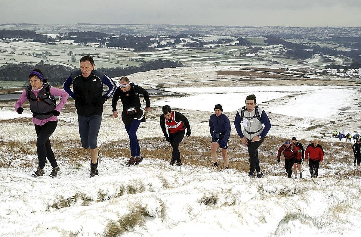 runners in a snowy field